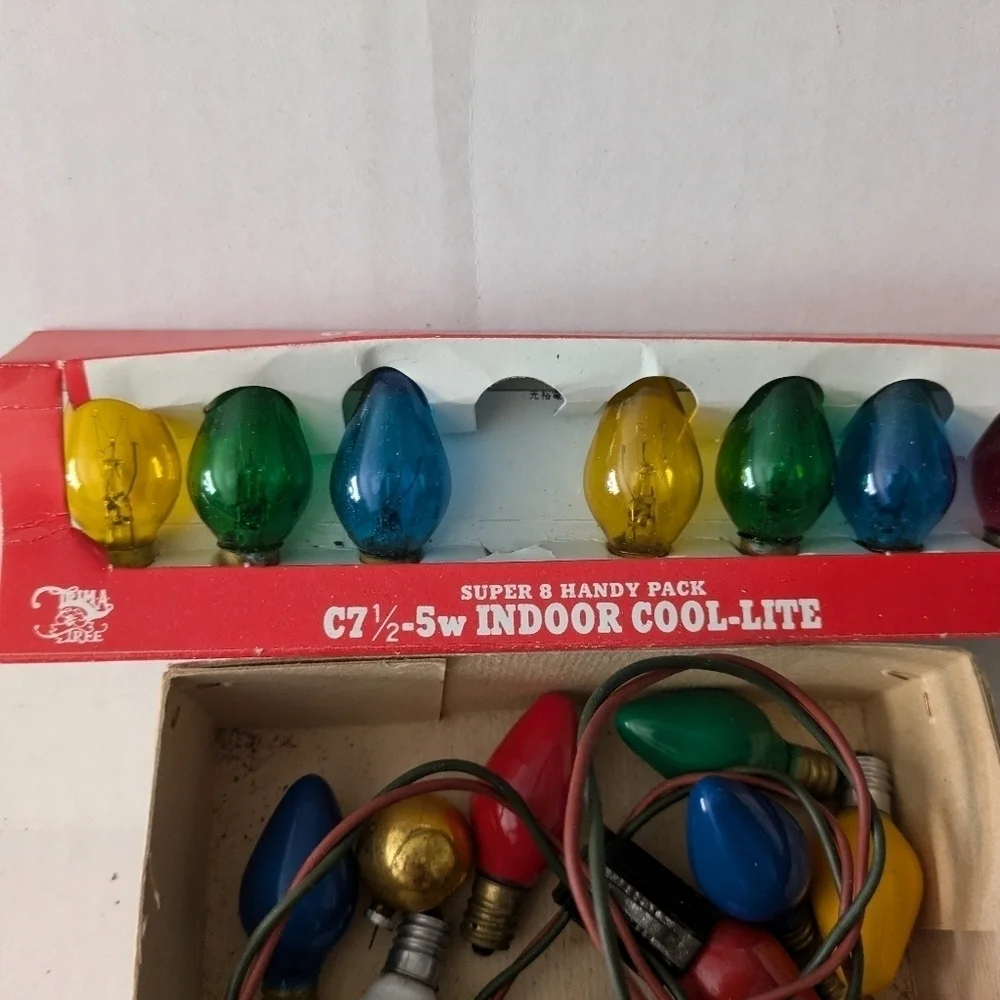 Vintage Christmas lights Multicolor and extra bulbs.